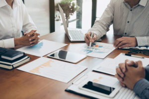 15 Ways to Be More Profitable in Your Small Business » Succeed As Your Own Boss 2 businesspeople financialpapers