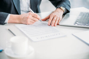 business woman signing contract