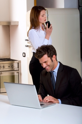 Professional Couple Working From Home